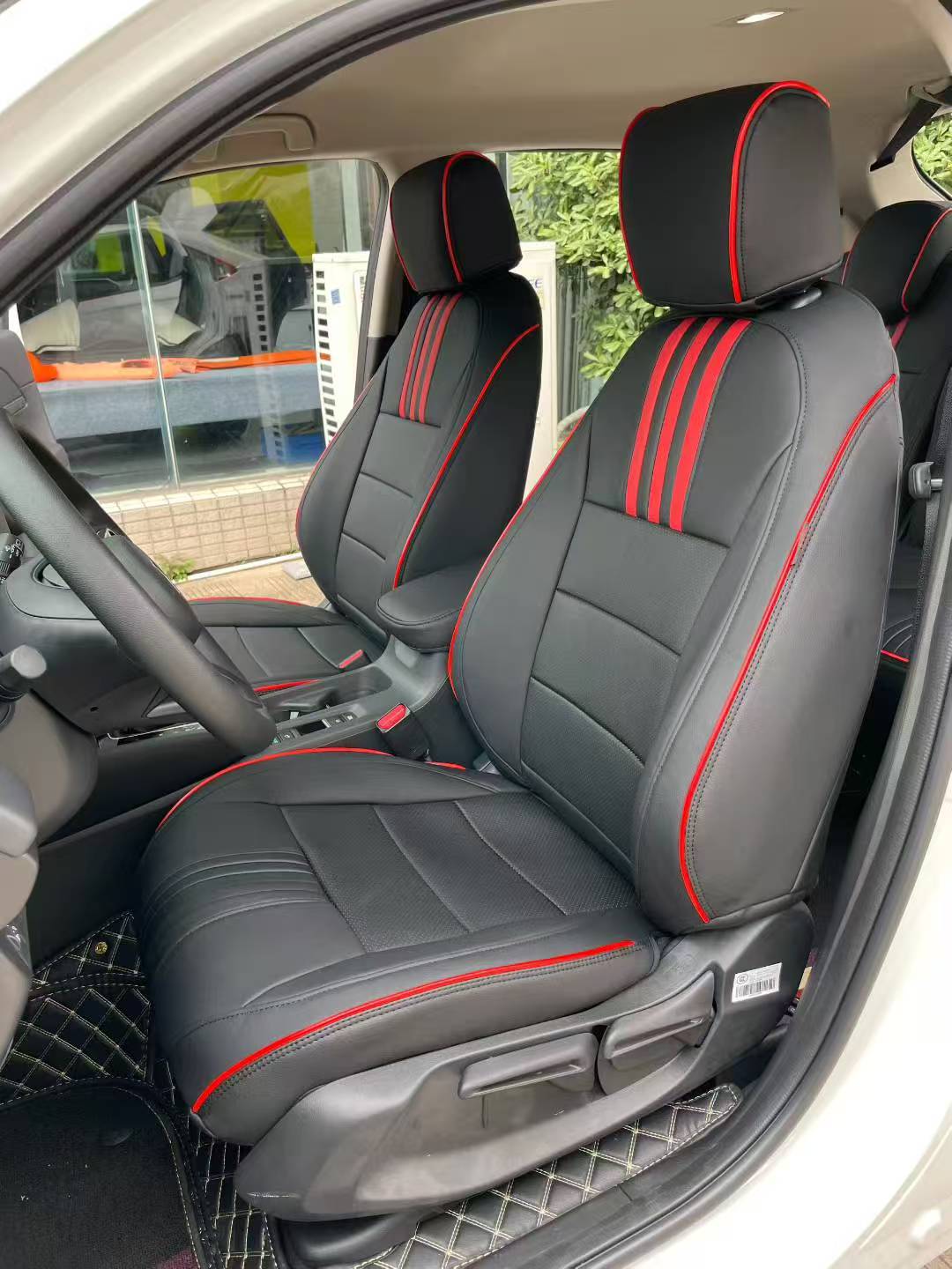 Black custom seat covers with red stripes