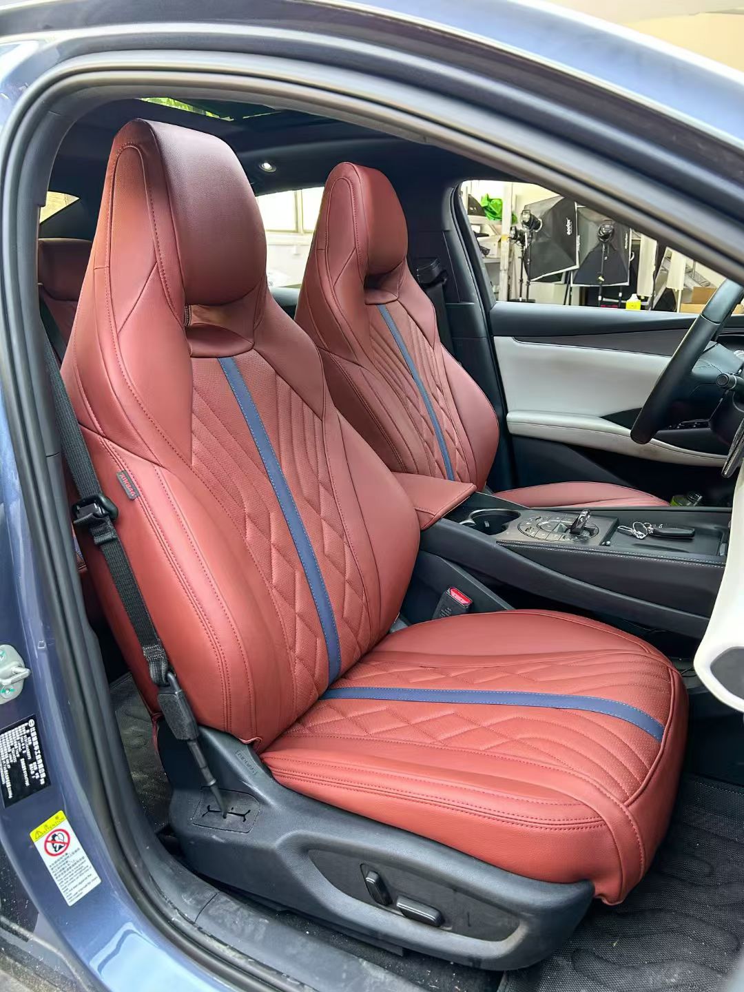 Burgundy seat covers with blue accent stripes